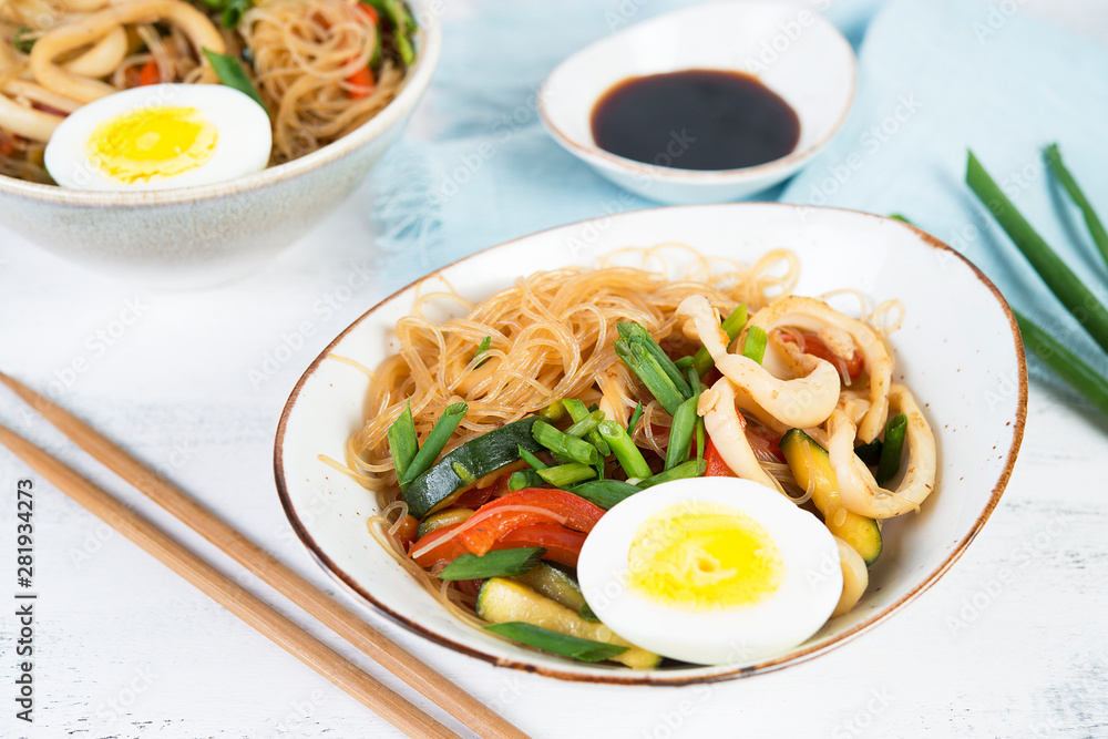 Traditional Asian stir fry with noodles, seafood and vegetables. Traditional Asian stir fry with noodles, seafood and vegetables.