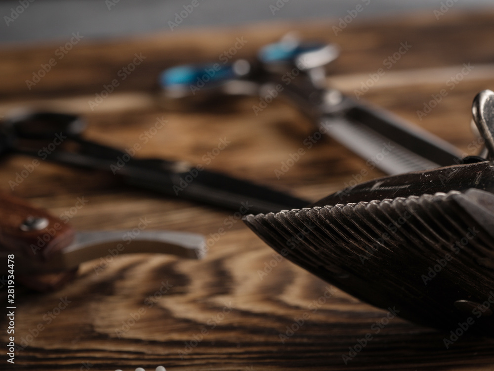 the barber shops tools on wooden desk. the barber shops tools on wooden desk.