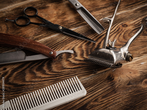 the barber shops tools on wooden desk.