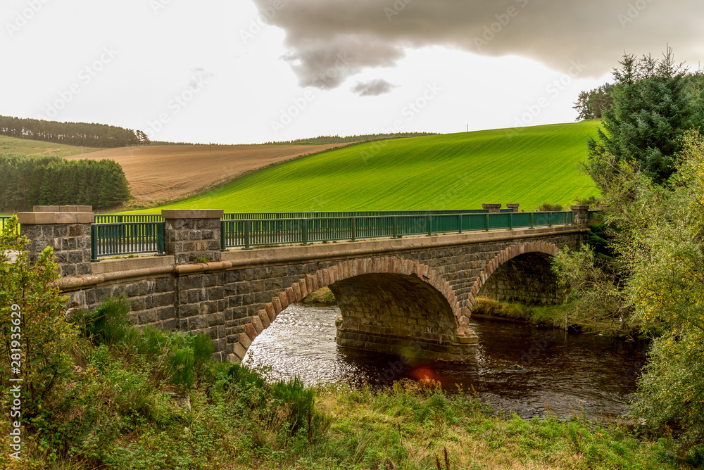 A scenic arch bridge over the river in autumn, Cairngorms National Park A scenic arch bridge over the river in autumn, Cairngorms National Park