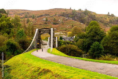 Entrance for public to the historic Bridge of Oich currently serving as a footbridge over the River Oich near Aberchalder, Scotland photo