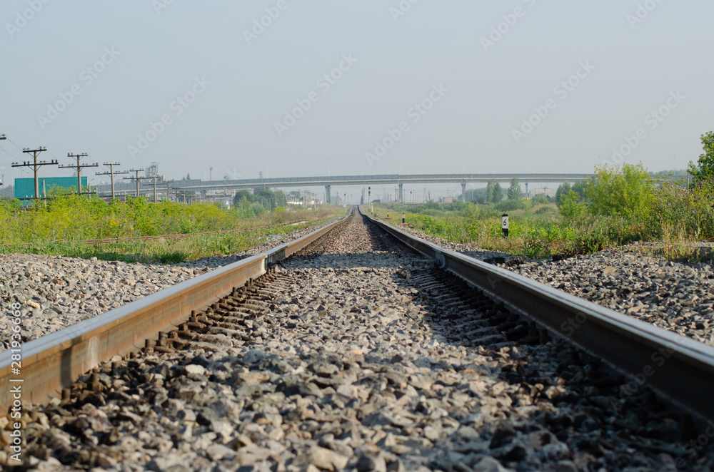 early morning railroad with gravel and green grass. early morning railroad with gravel and green grass.