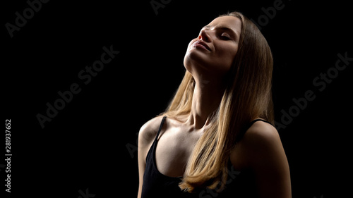 Woman smiling and deeply breathing, enjoying freedom, fight against insecurities