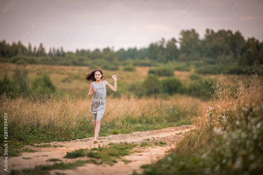 girl running across the field girl running across the field