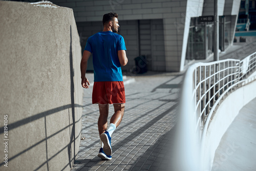 Sporty man walking on outdoor training in city © Yakobchuk Olena