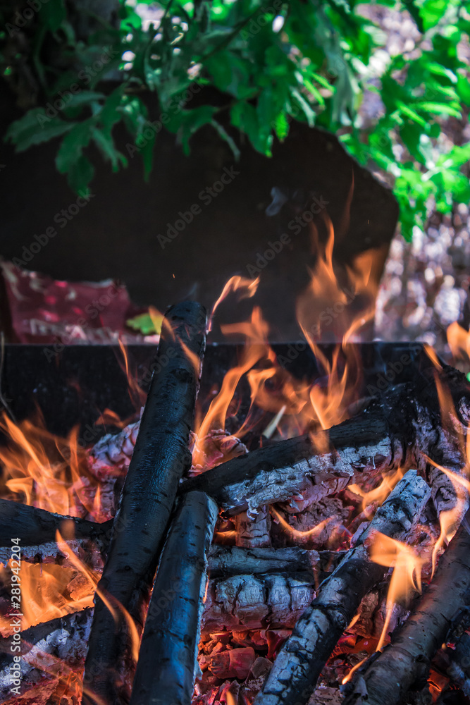 Burning coals in a barbecue, cooking barbecue outdoors Burning coals in a barbecue, cooking barbecue outdoors