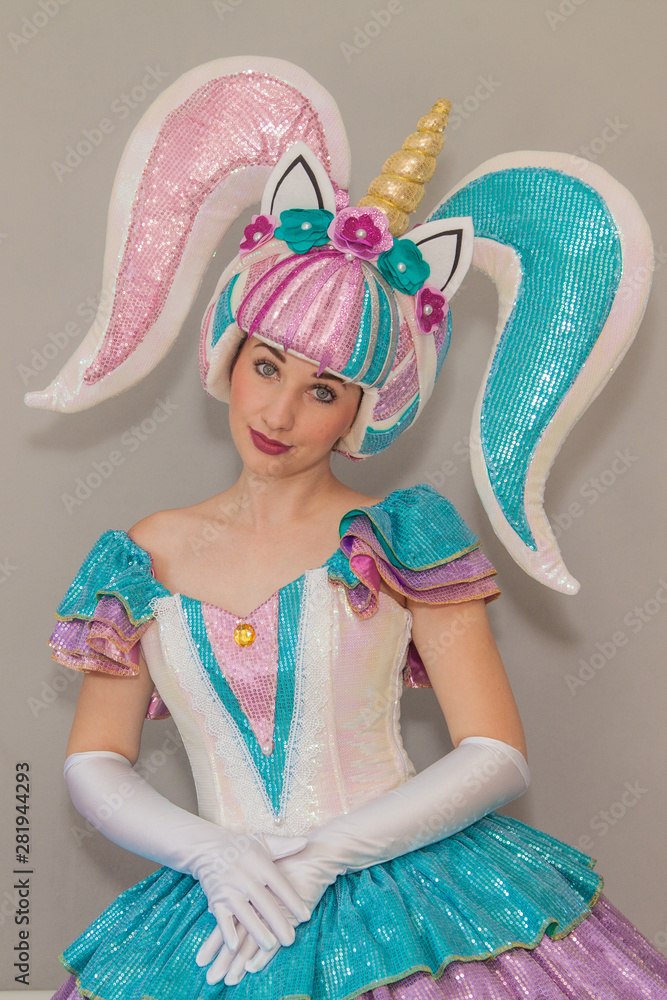 girl in a doll costume lol unicorn. Leading a children's party in a doll costume. Stock Photo