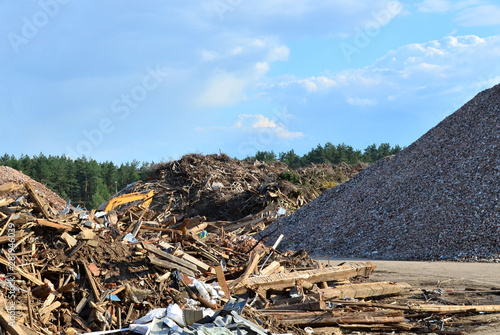 Industrial waste treatment processing plant. Landfill with industrial waste. Construction waste process, concrete recycling, crushing and recycling of construction mixed waste and demolition material