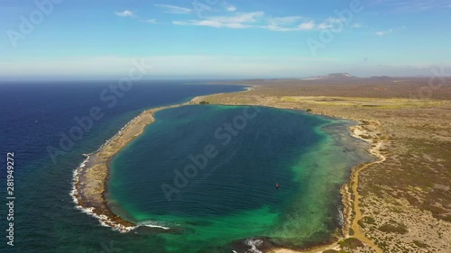Aerial view of coast of Curaçao in the Caribbean Sea with turquoise water, cliff, beach and beautiful coral reef around Eastpoint photo