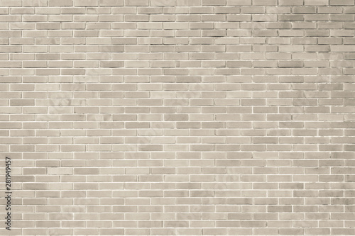 Brick wall pattern texture background in light beige repia brown color