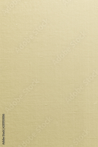 Silk cotton linen blended fabrics textile textured background in light yellow cream beige gold color
