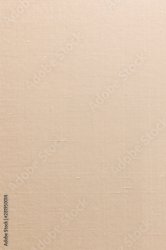 Beige silk cotton linen blended fabric background in light orange cream beige sepia color