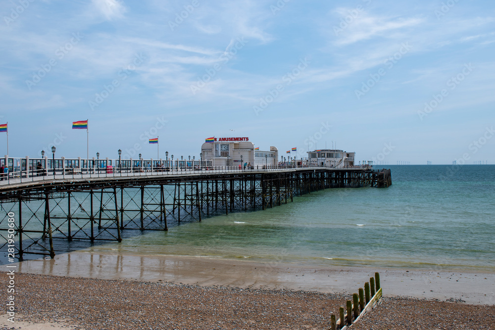 Worthing Pier with Rainbow Flags Fluttering on Pride Parade day.