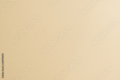 Cotton fabric woven textile textured background in yellow gold cream beige color .
