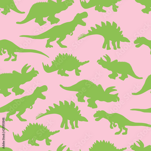 Green colour dinosaurs silhouette seamless pattern on pink background