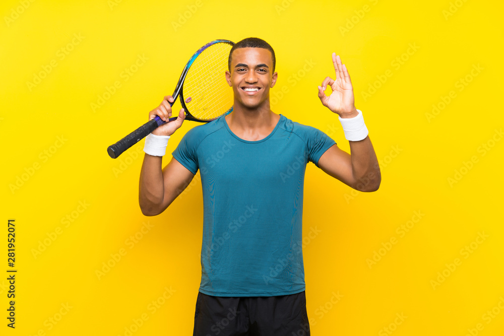 African American tennis player man showing ok sign with fingers African American tennis player man showing ok sign with fingers