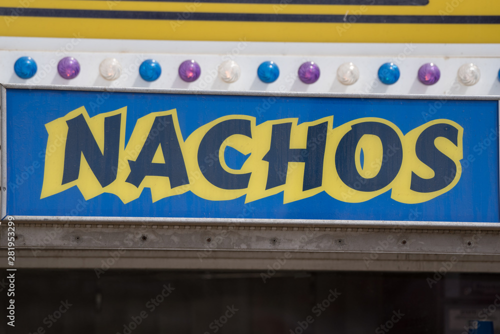 Large sign clearly advertises to potential customers where to purchase delicious Nachos.
