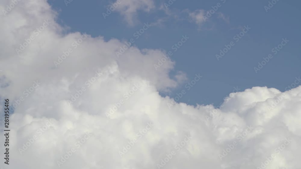 Clouds time lapse video features the time lapse of clouds swirling below the blue sky. Clouds time lapse video features the time lapse of clouds swirling below the blue sky.