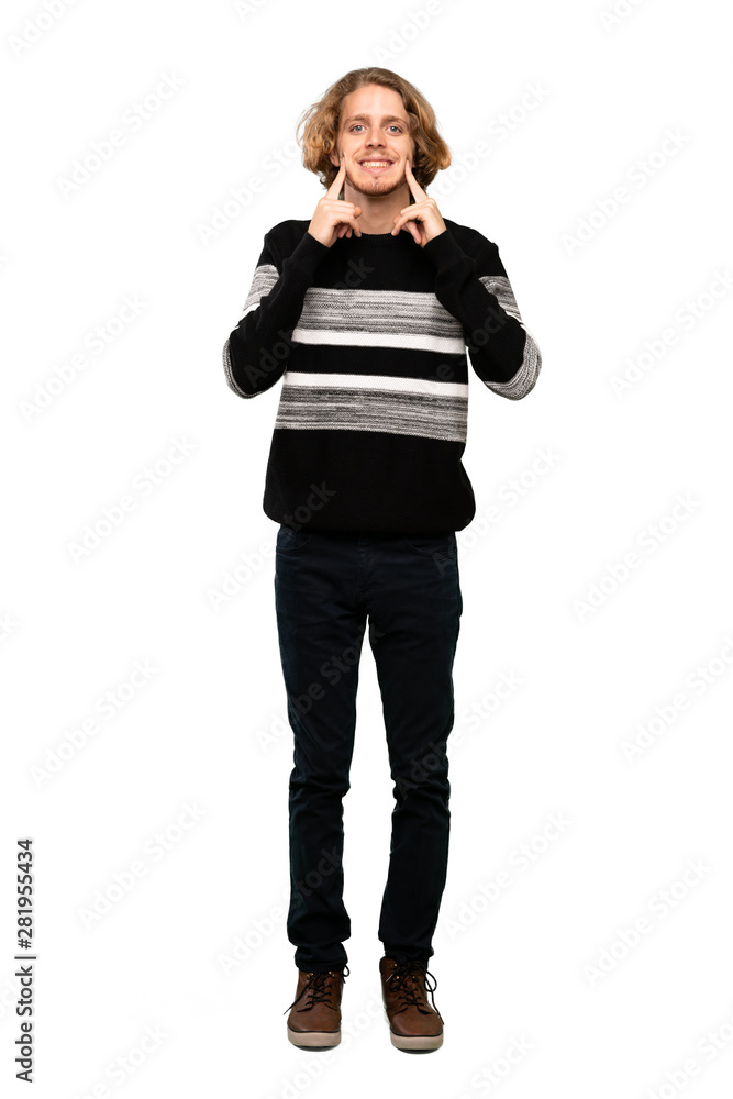 Full-length shot of Blonde man smiling with a happy and pleasant expression over isolated white background Full-length shot of Blonde man smiling with a happy and pleasant expression over isolated white background