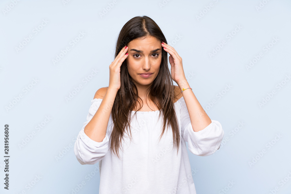 Young woman over isolated blue background unhappy and frustrated with something. Negative facial expression Young woman over isolated blue background unhappy and frustrated with something. Negative facial expression