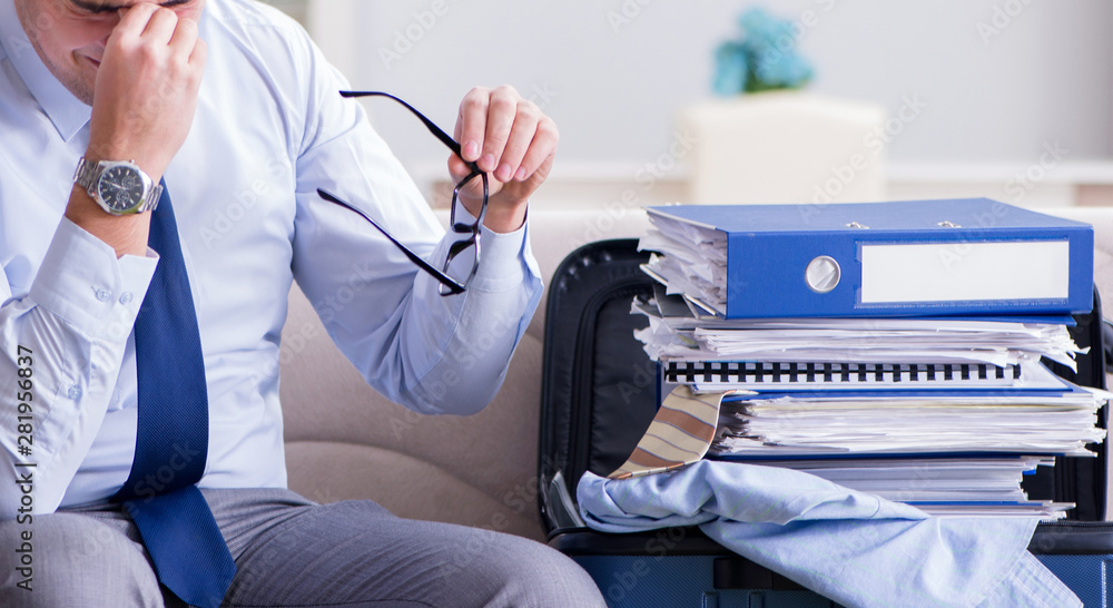 Fototapeta premium Businessman preparing packing for business trip