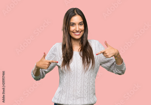 Young hispanic brunette woman proud and self-satisfied over isolated background