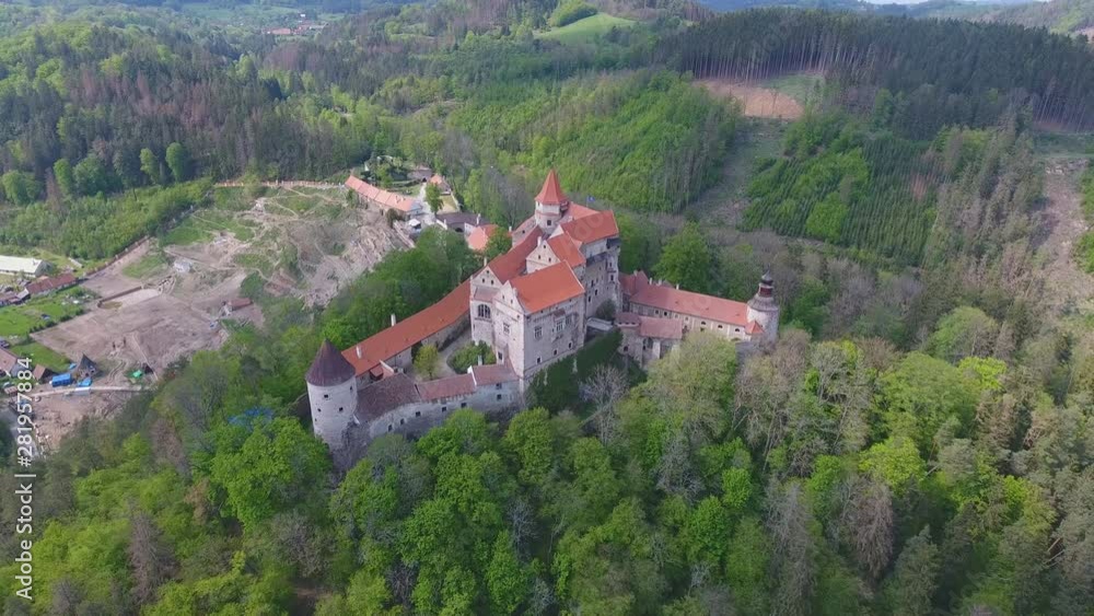 Aerial view of Moravian castle Pernstejn, standing on a hill above deep forests of the Bohemian-Moravian Highlands, Czech Republic, Europe Aerial view of Moravian castle Pernstejn, standing on a hill above deep forests of the Bohemian-Moravian Highlands, Czech Republic, Europe