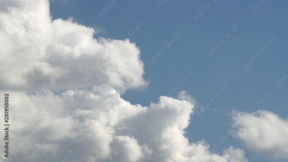 Clouds time lapse video features the time lapse of clouds swirling below the blue sky. Clouds time lapse video features the time lapse of clouds swirling below the blue sky.