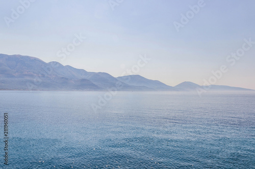 Sticker Landscape with water and mountains in the background, Albania