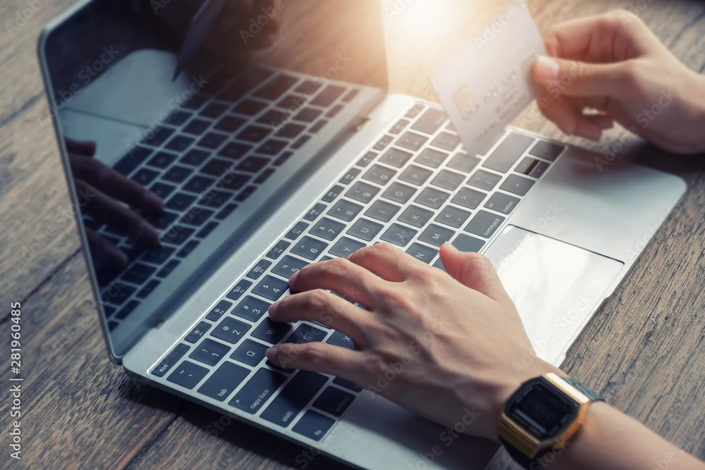 Online payment, Female using computer and holding credit card to Order products on the internet. Online payment, Female using computer and holding credit card to Order products on the internet.