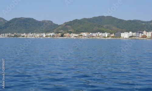 View of the embankment of the city of Marmaris from the sea. City-port and resort in Turkey. Sandy beaches, mountain landscapes. © TATIANA