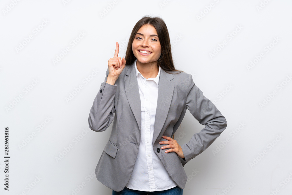 Young business woman over isolated white background showing and lifting a finger in sign of the best Young business woman over isolated white background showing and lifting a finger in sign of the best