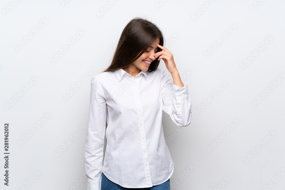 Young woman over isolated white background laughing Young woman over isolated white background laughing