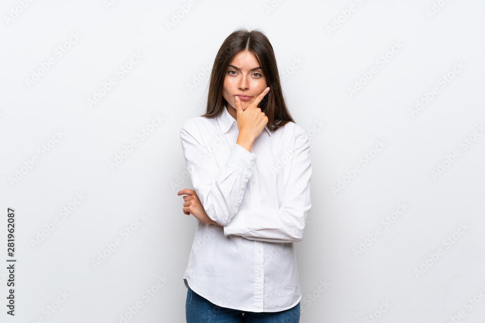 Young woman over isolated white background thinking an idea Young woman over isolated white background thinking an idea
