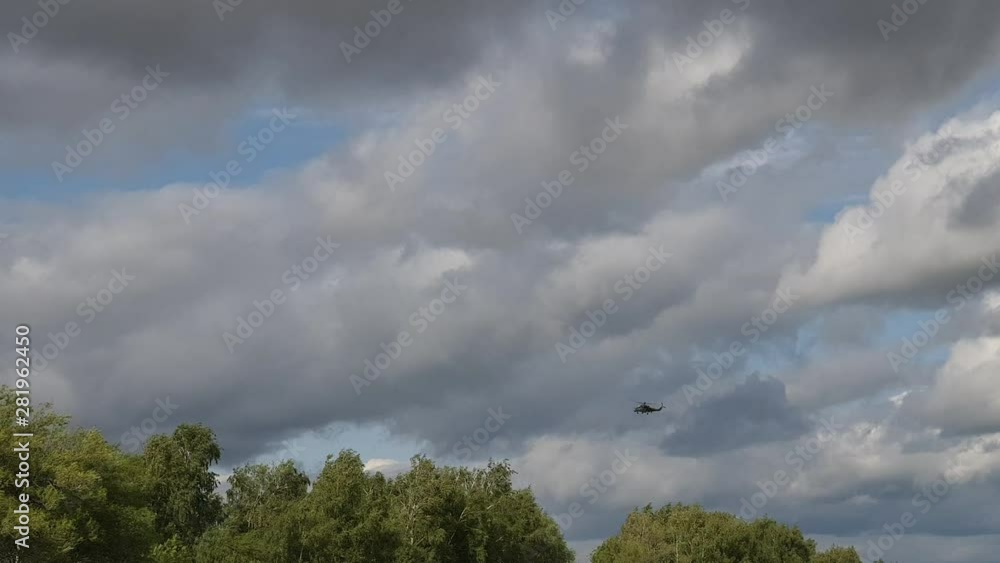 the helicopter flies over the road, and Russian combat helicopter the helicopter flies over the road, and Russian combat helicopter