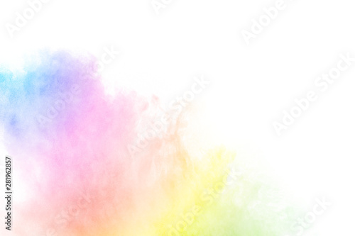 The explosion of multi colored powder. Beautiful rainbow color powder fly away. The cloud of glowing color powder on white background