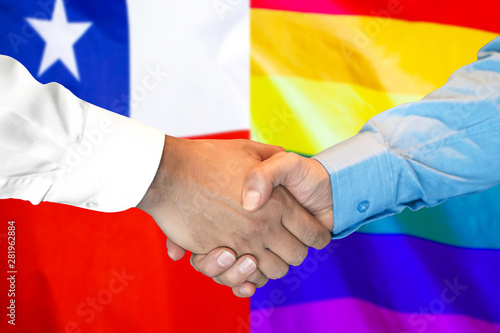 handshake on Chile and LGBT gay flag background.