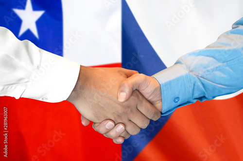 Business handshake on the background of two flags. Men handshake on the background of the Chile and Czech Republic flag. Support concept