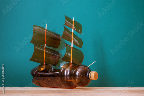 Obraz na płótnie Toy ship made of a plastic bottle. Recycle crafts. w salonie