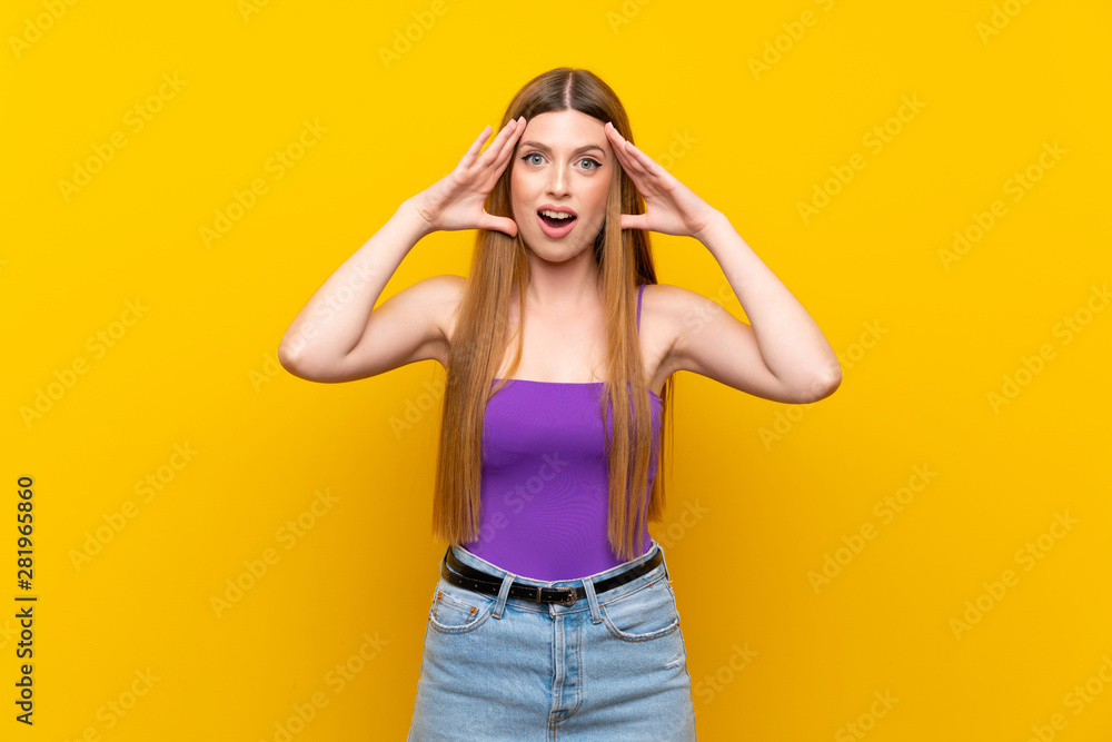 Young woman over isolated yellow background with surprise expression Young woman over isolated yellow background with surprise expression