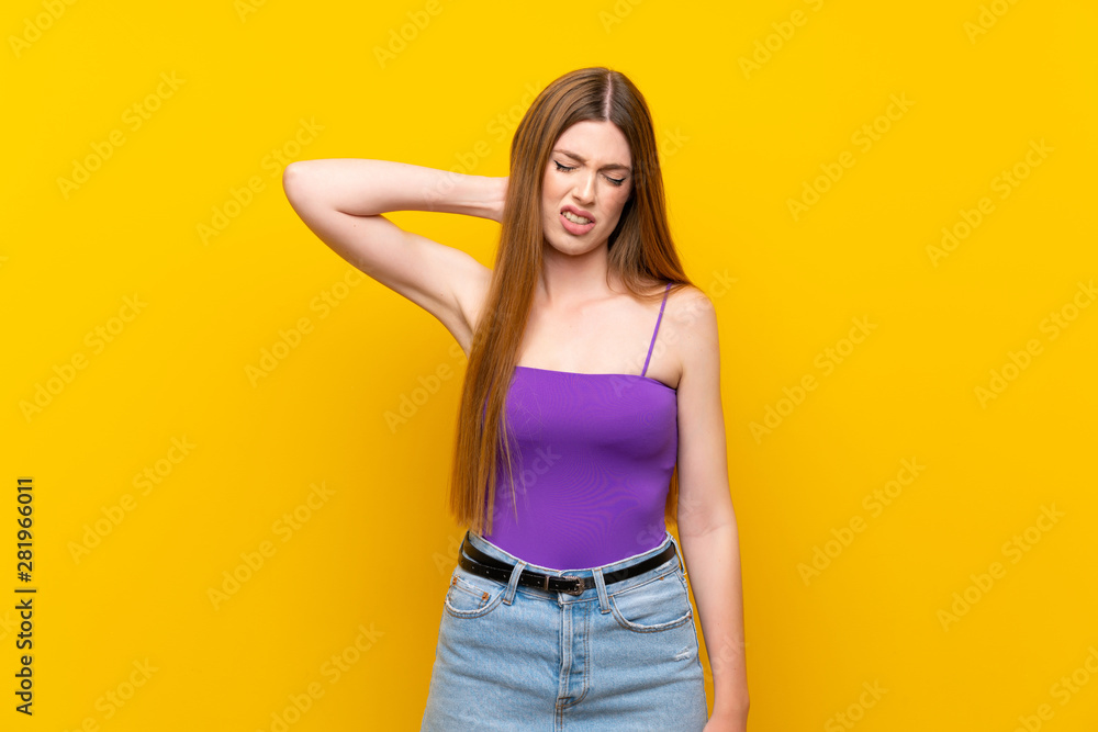Young woman over isolated yellow background with neckache Young woman over isolated yellow background with neckache