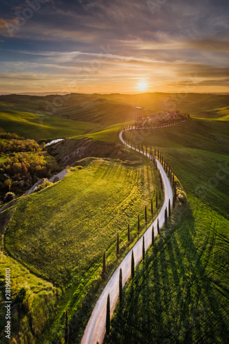 Aerial drone landscape of famous Tuscany hills, Italy spring fields sunset Asciano Siena Firenze