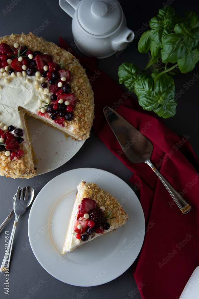 Vegan delicious carrot and orange cake decorated with berries. Healthy dessert. Grey background. Piece of cake. Vegan delicious carrot and orange cake decorated with berries. Healthy dessert. Grey background. Piece of cake.
