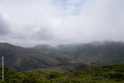 Rolling fog blocking view of nature, forest, hills, and trailhead © David Tran