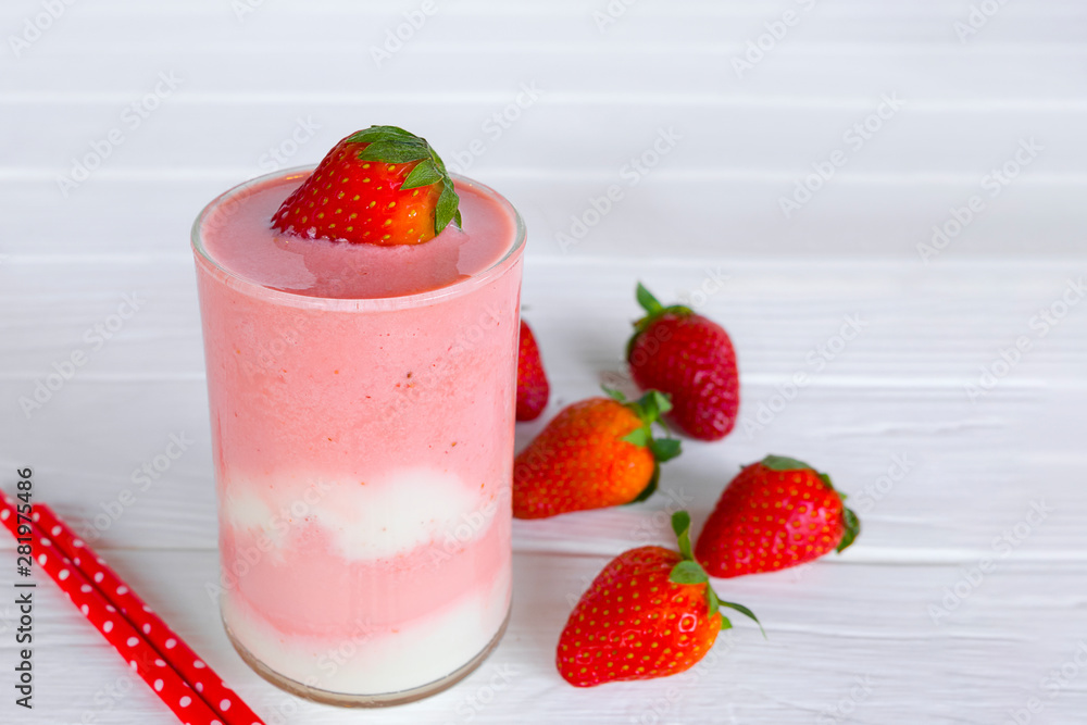 Strawberry smoothies pink colorful fruit juice beverage healthy high protein the taste yummy in glass on white wood background. Strawberry smoothies pink colorful fruit juice beverage healthy high protein the taste yummy in glass on white wood background.