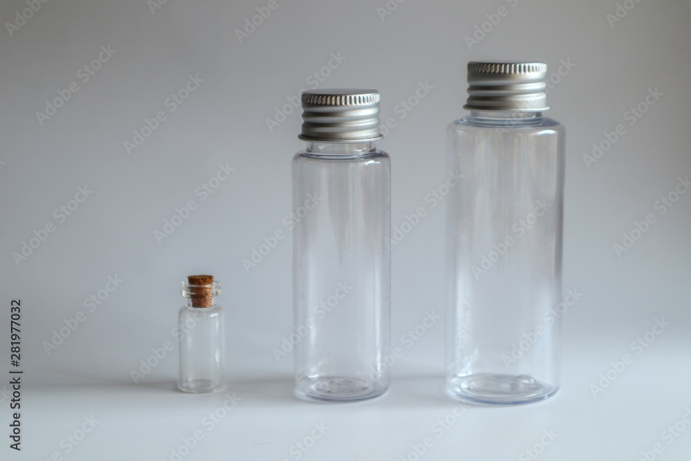 Model image of clear glass bottle with metal lid on white background,mockup Model image of clear glass bottle with metal lid on white background,mockup