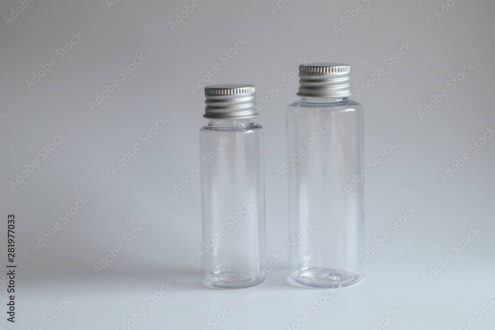 Model image of clear glass bottle with metal lid on white background,mockup Model image of clear glass bottle with metal lid on white background,mockup