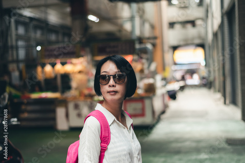Asian woman walk in the traditional marketplace
