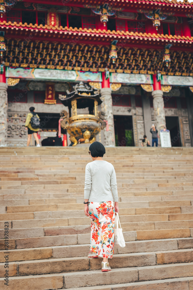 traveling woman walk to a temple