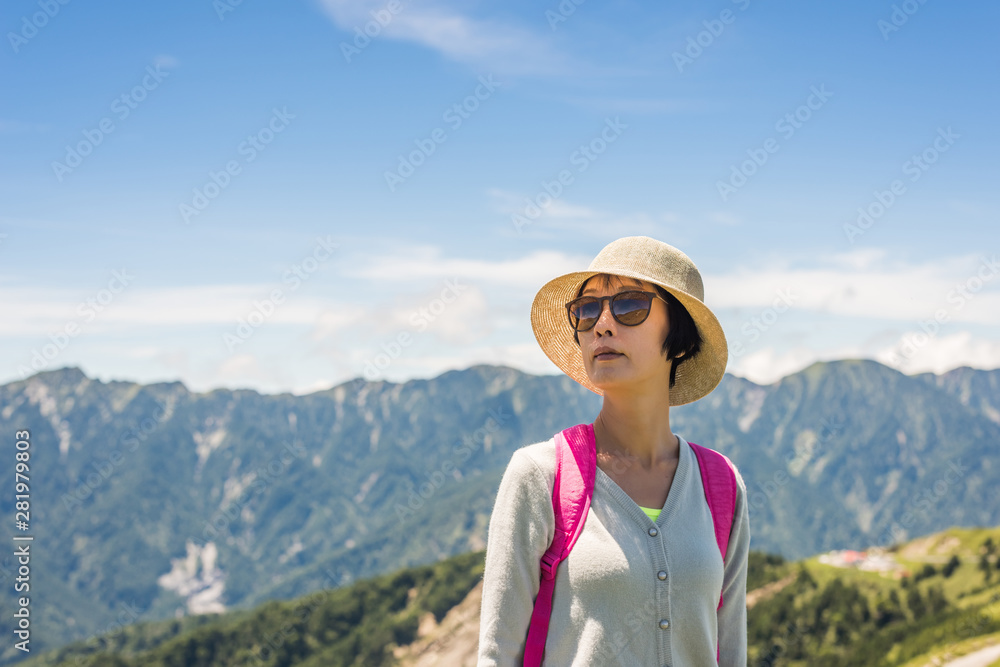 Asian mountain climbing woman